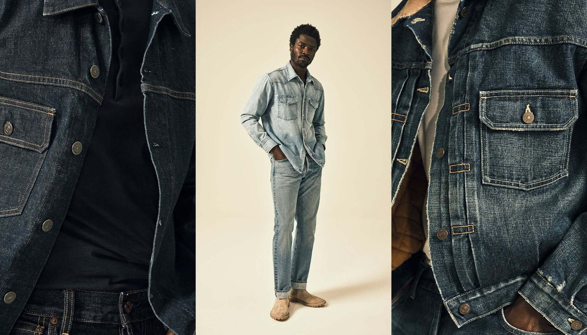 A stack of jeans beside a man wearing a pair of jeans